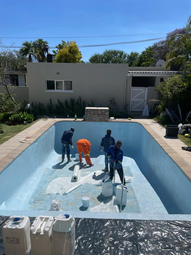 Expert team installing or repairing a swimming pool in Cape Town.