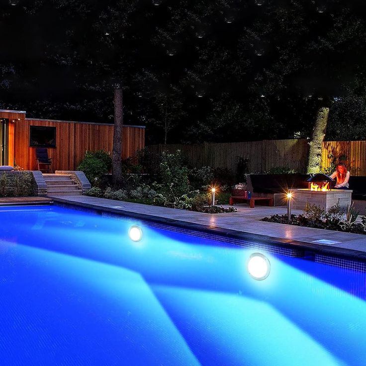 Energy-efficient LED pool lighting illuminating a modern swimming pool in Cape Town at night