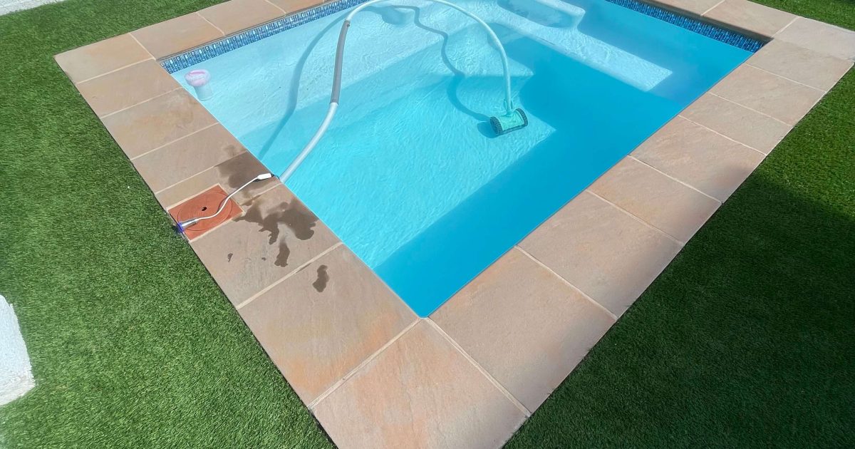Well-maintained swimming pool with clean water and neat paving in Protea Heights, Cape Town. I