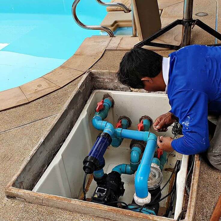 Pools Reno technician servicing a chlorinator in Kenwyn
