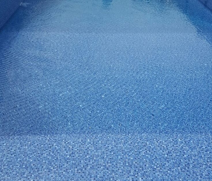 Vinyl swimming pool installation in progress with reinforced wall panels, smooth liner placement, and clear blue water – modern backyard pool upgrade in Cape Town.
