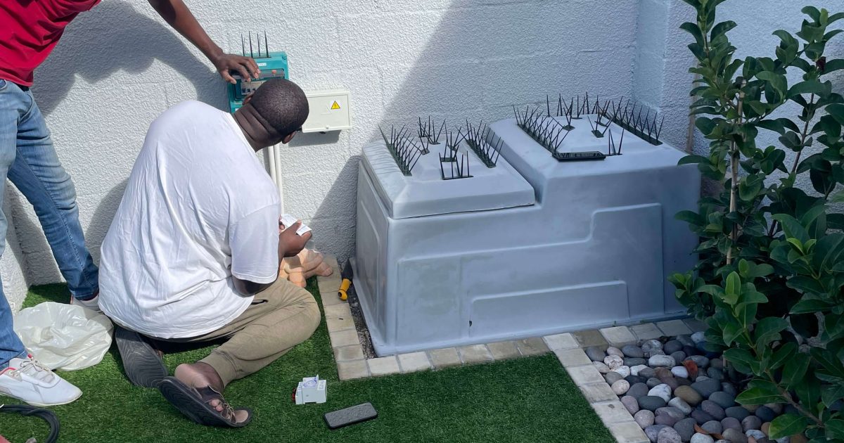 Well-maintained pool pump and filtration system installed in a secure housing in Brackenfell, Cape Town