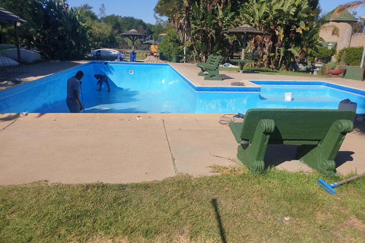 Technician inspecting pool system at a wine estate in Paarl