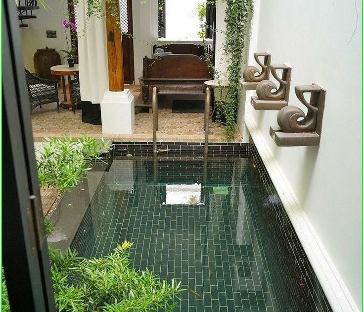 Stunning pool enclosed with glass with outdoor view and sunlight