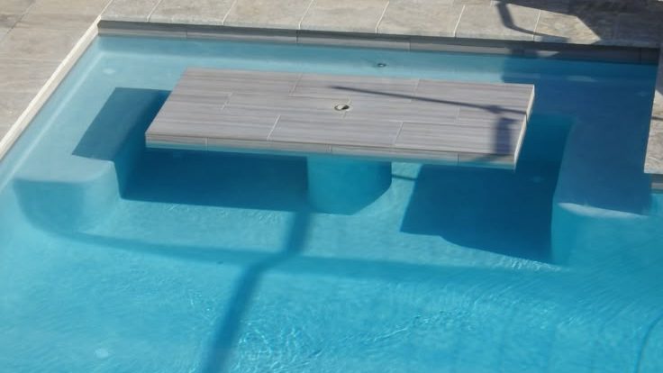 Modern lounging ledge upgrade for Cape Town pools Built-in sun shelf and underwater bench in Cape Town pool