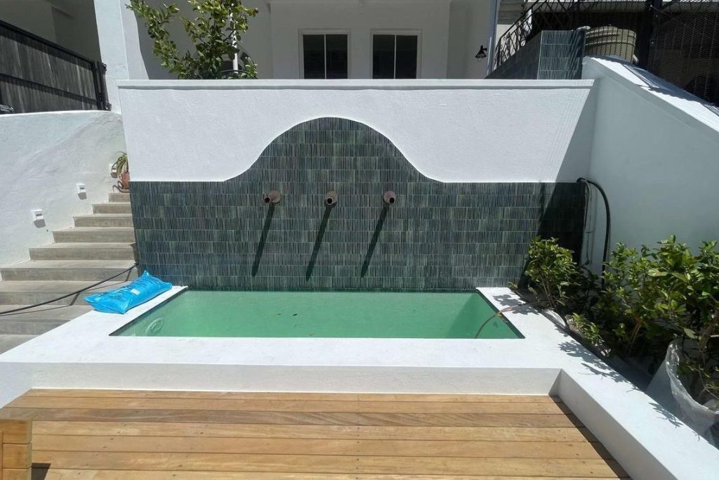 Finished plunge pool with heating and lighting features