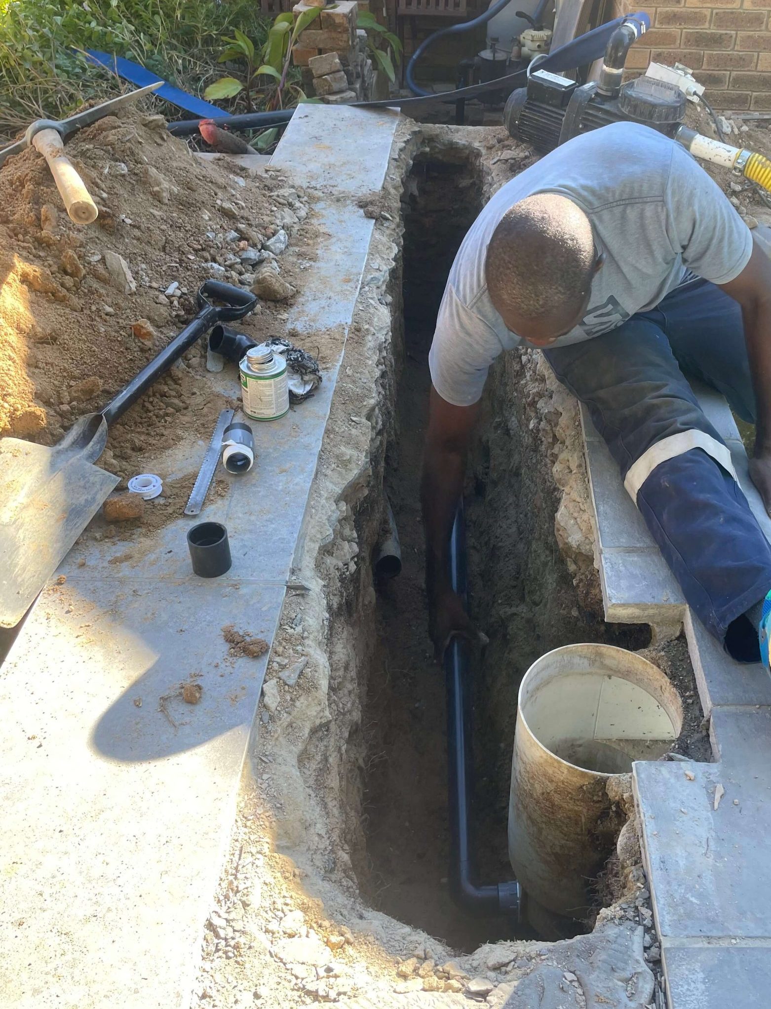 Swimming pool technician fixing a leaking Skimmer box Langebaan