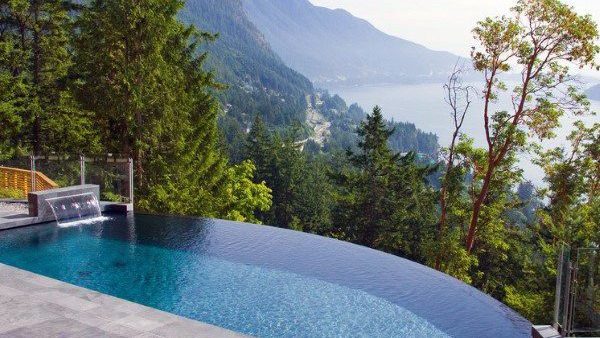 Luxury infinity pool design in Cape Town’s Atlantic Seaboard Infinity edge pool with mountain views in Cape Town