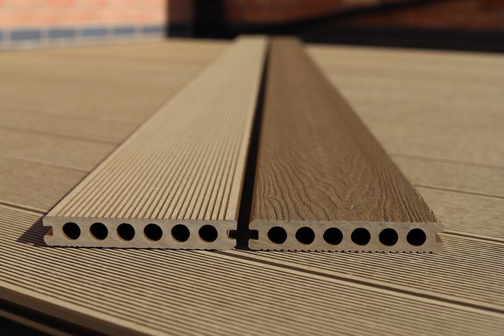 Capped hollow composite decking installed around a modern pool in Cape Town