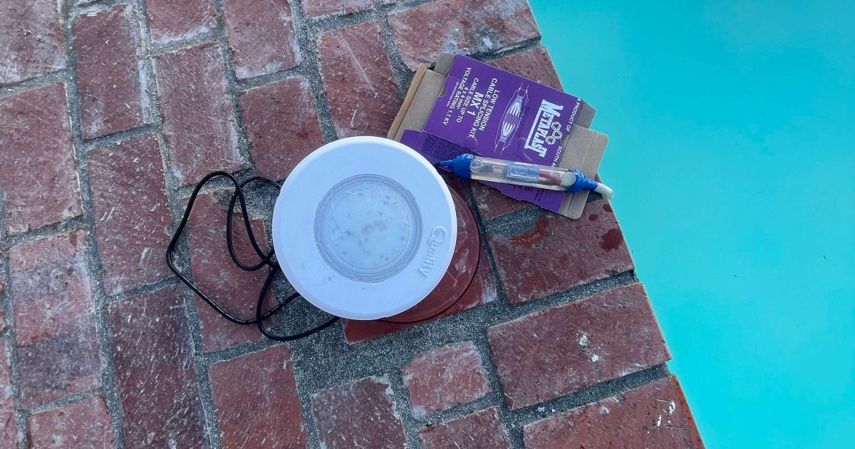 Close-up of a modern underwater LED pool light installed in a tiled swimming pool in Cape Town, South Africa