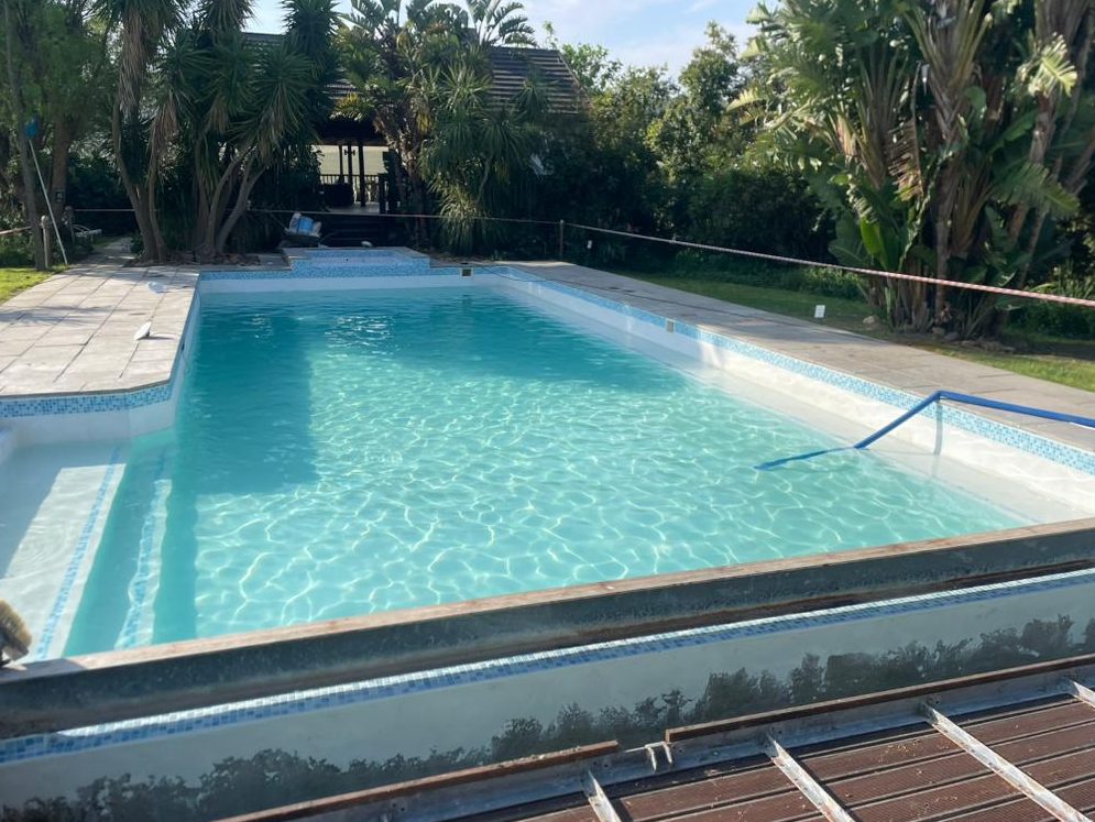 Newly marbelite lined swimming pool filled with clear water in Cape Town
