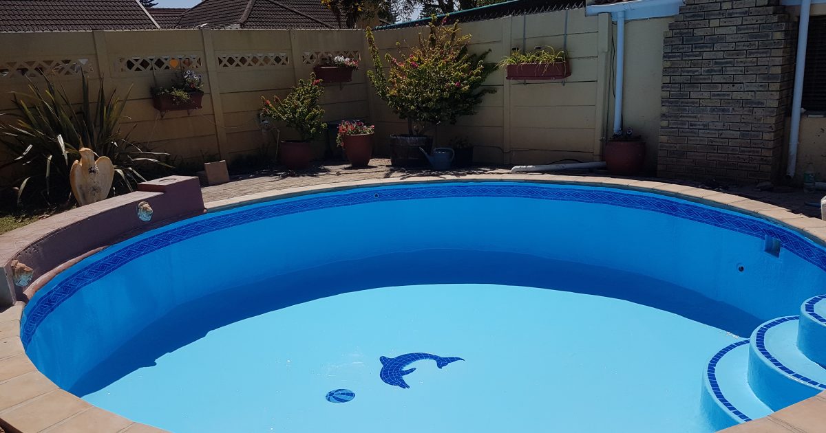 Beautifully finished swimming pool in Hout Bay after fibreglass relining by Pools Reno, showcasing a smooth, glossy surface and modern blue finish perfect for coastal homes.