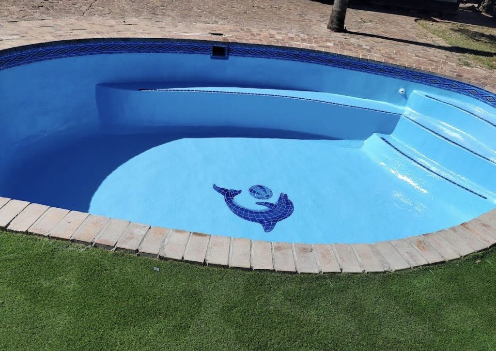 Freshly fibreglass lined swimming pool completed by Pools Reno in Camps Bay, Cape Town, showing smooth modern finish