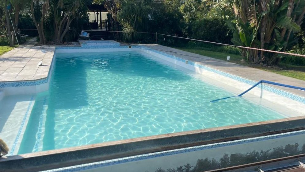 Beautifully refurbished marbelite swimming pool relined and restored by Pools Reno in Cape Town, featuring a smooth, durable surface and refreshed finish for long-lasting elegance.