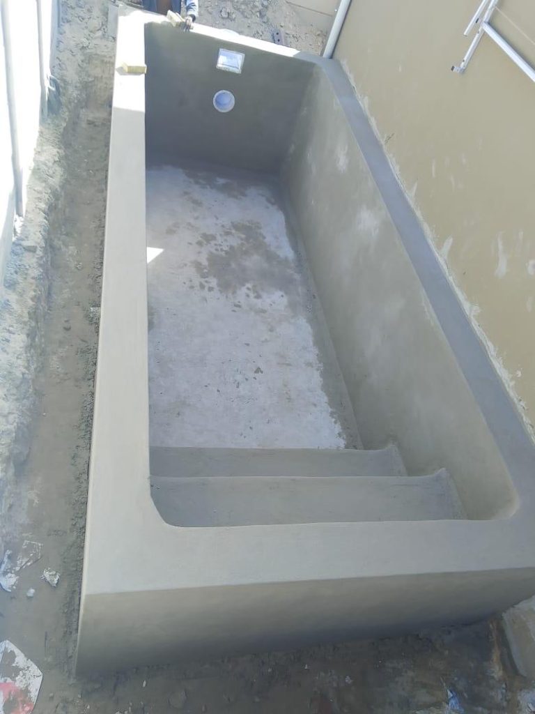 Concrete swimming pool after plastering in Cape Town, prepared for waterproofing and fibreglass lining
