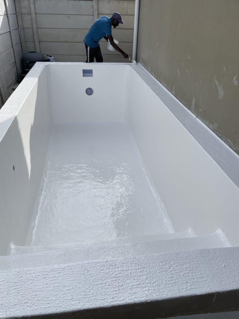 Final painting of a fibreglass-lined concrete pool in Cape Town, creating a clean and sparkling swimming pool finish