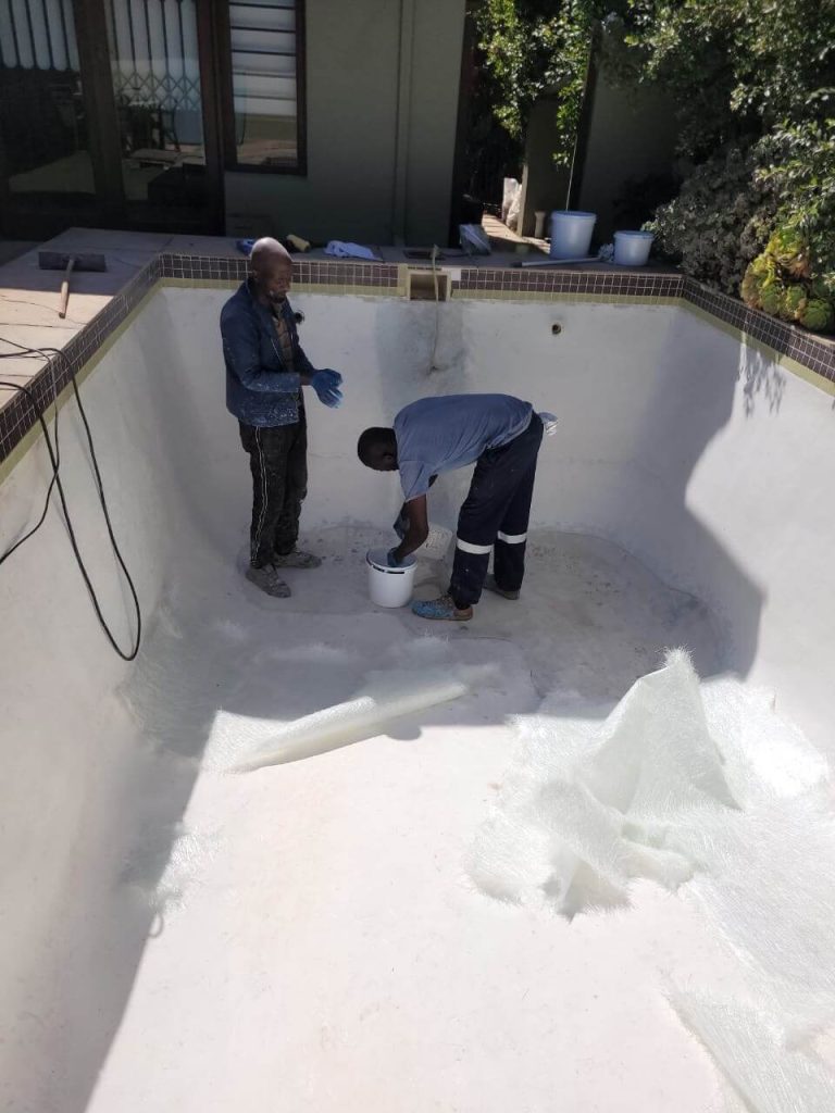 Professional fibreglass pool relining in progress by Pools Reno in Cape Town, showing smooth application for a durable, watertight swimming pool surface.