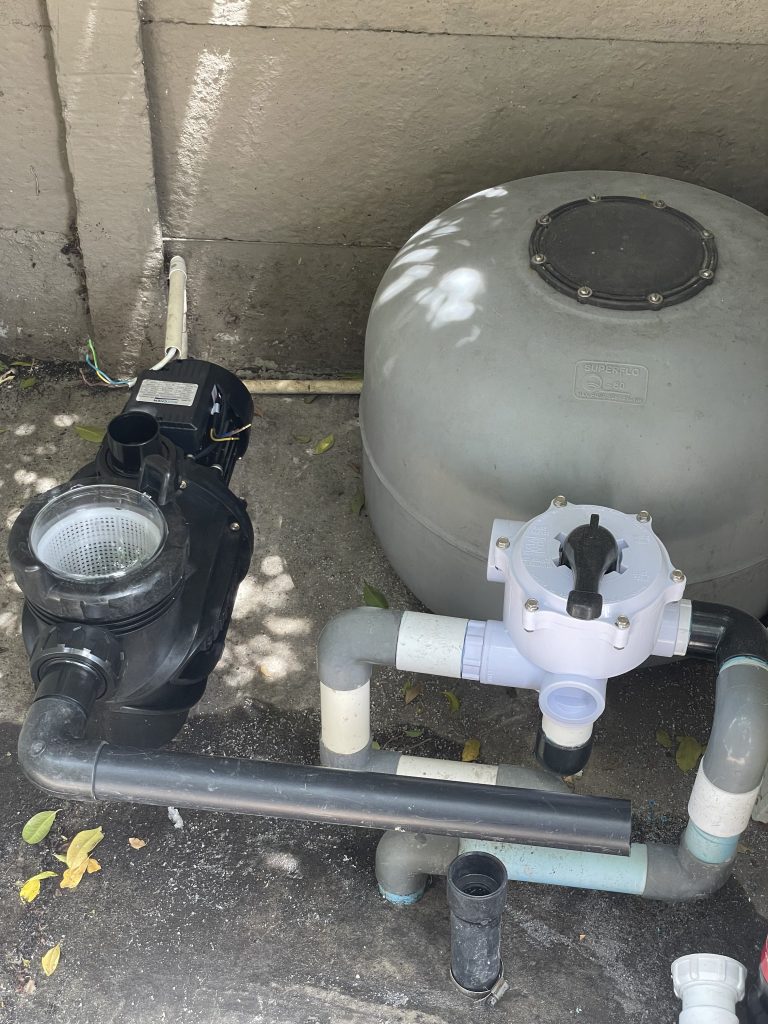 Old pool pump and sand filter replaced with a new energy-efficient filtration system by Pools Reno in Cape Town, improving water circulation and pool filtration performance.