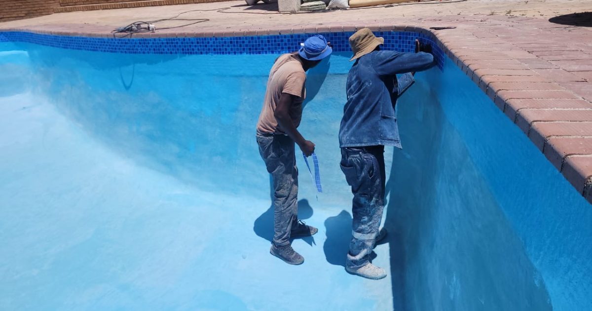 Tissue mosaic tiles being installed in a swimming pool to create a smooth, decorative finish in Cape Town