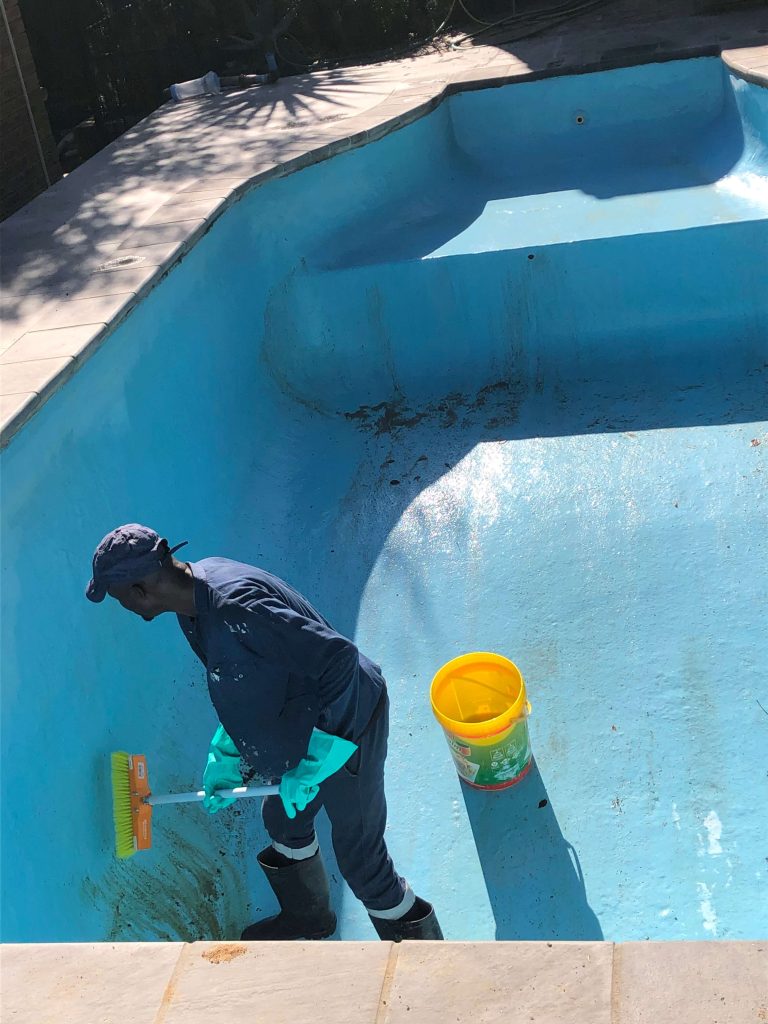 Swimming pool in Wellington undergoing professional deep cleaning before complete refurbishment, removing algae, dirt, and surface contamination prior to renovation by Pools Reno.