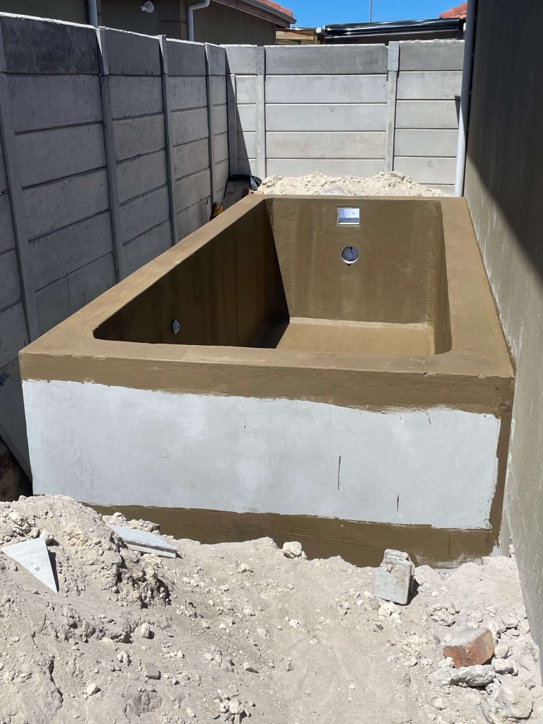 Professional waterproofing being applied to a concrete pool in Cape Town for long-lasting protection