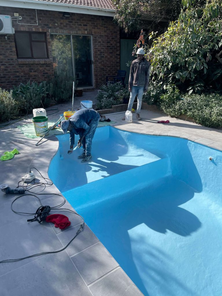 Dirty and neglected swimming pool in Wellington undergoing professional renovation and deep cleaning to remove algae and fungal growth, showing active treatment by Pools Reno.