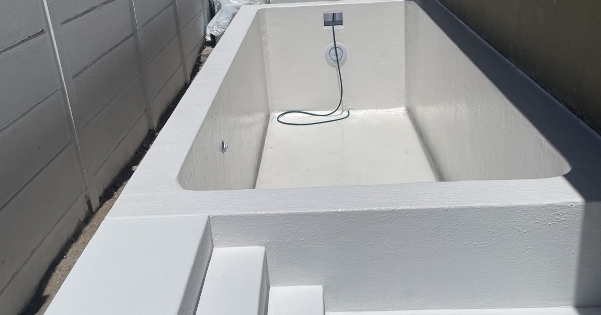 Fibreglass lined concrete swimming pool fully waterproofed and sealed, providing a smooth durable finish for long-term leak protection