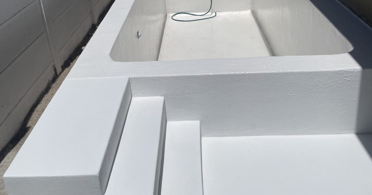 Fibreglass lined concrete swimming pool fully waterproofed and sealed, providing a smooth durable finish for long-term leak protection