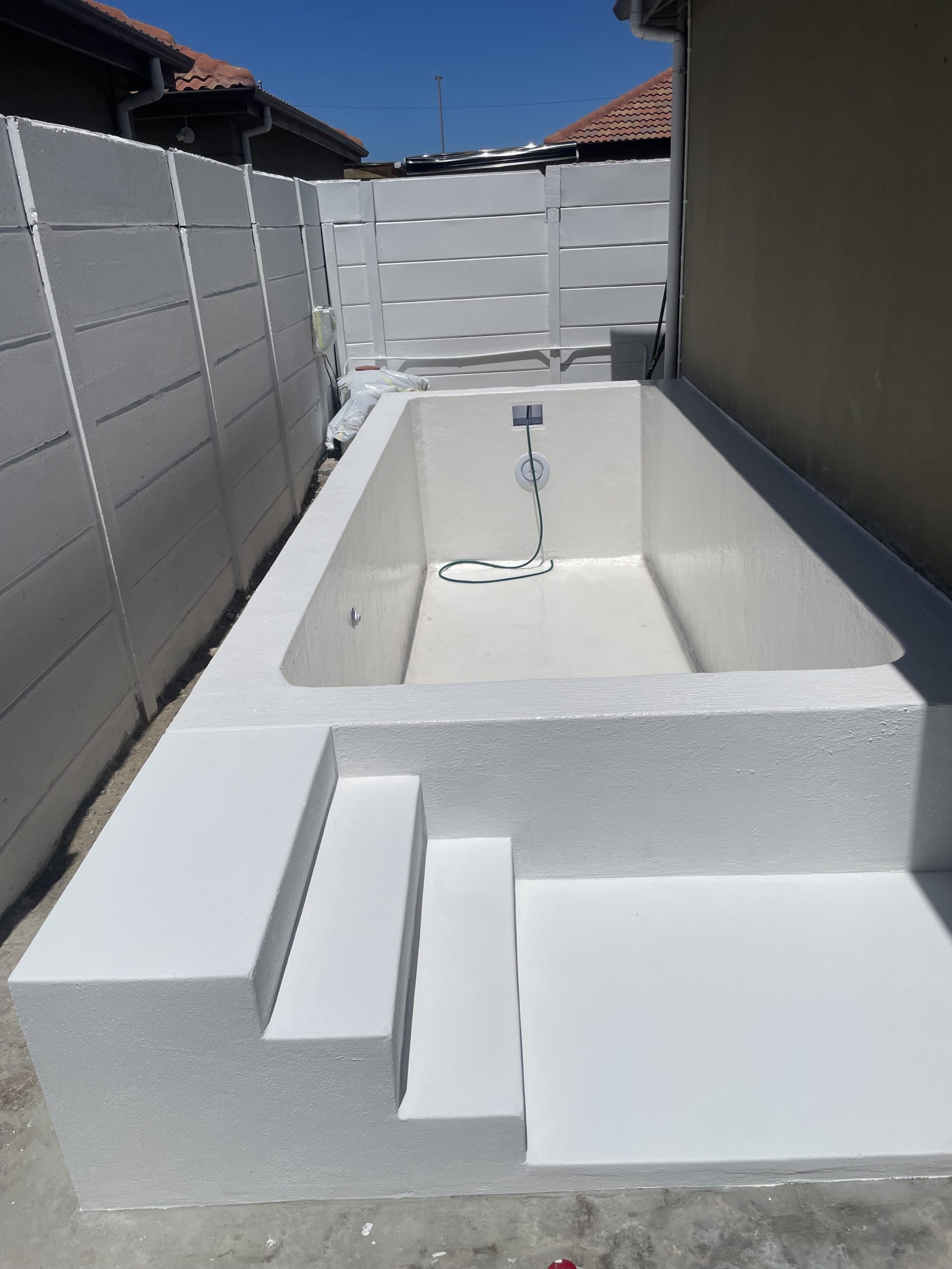 Fibreglass lined concrete swimming pool fully waterproofed and sealed, providing a smooth durable finish for long-term leak protection