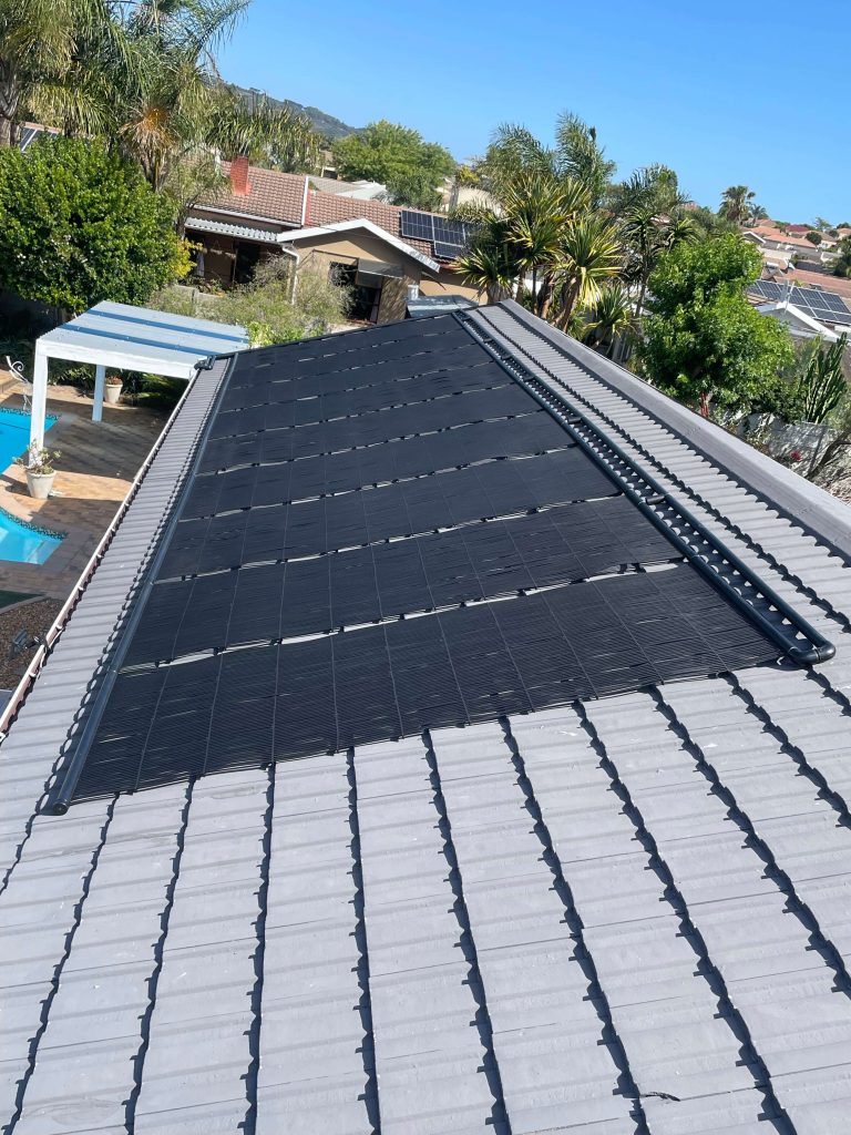 Professional solar pool heating system installed on a residential swimming pool in the Western Cape by Pools Reno