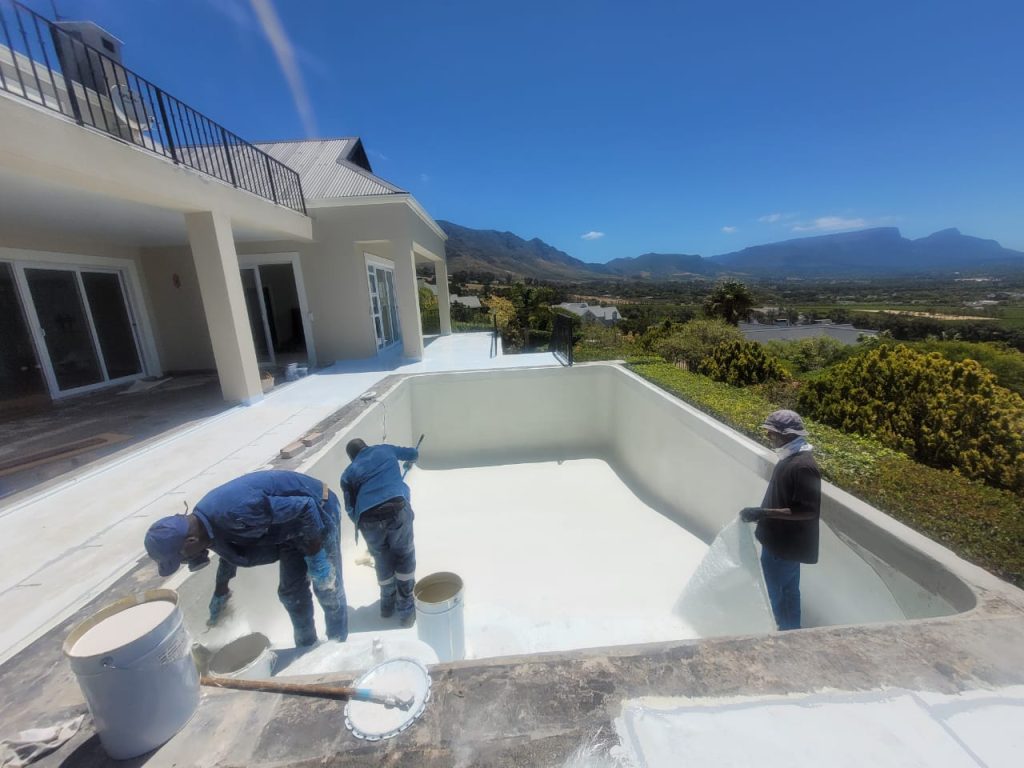 Concrete swimming pool in Tokai professionally relined with fibreglass for a smooth waterproof finish and long-lasting durability by Pools Reno