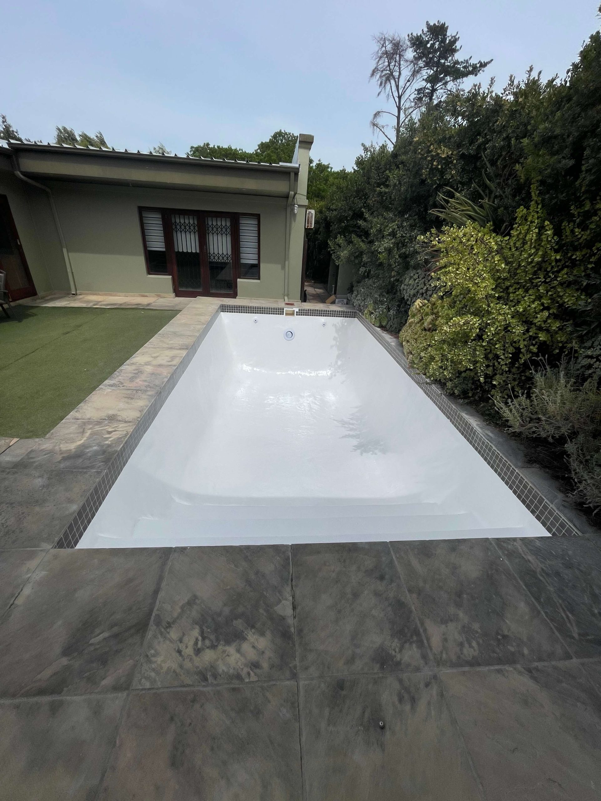 White pool transformed after fibreglass lining and renovation in Durbanville