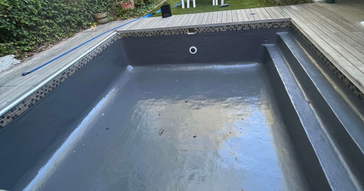 Grey gelcoat fibreglass pool in Cape Town with smooth modern finish and deep water colour