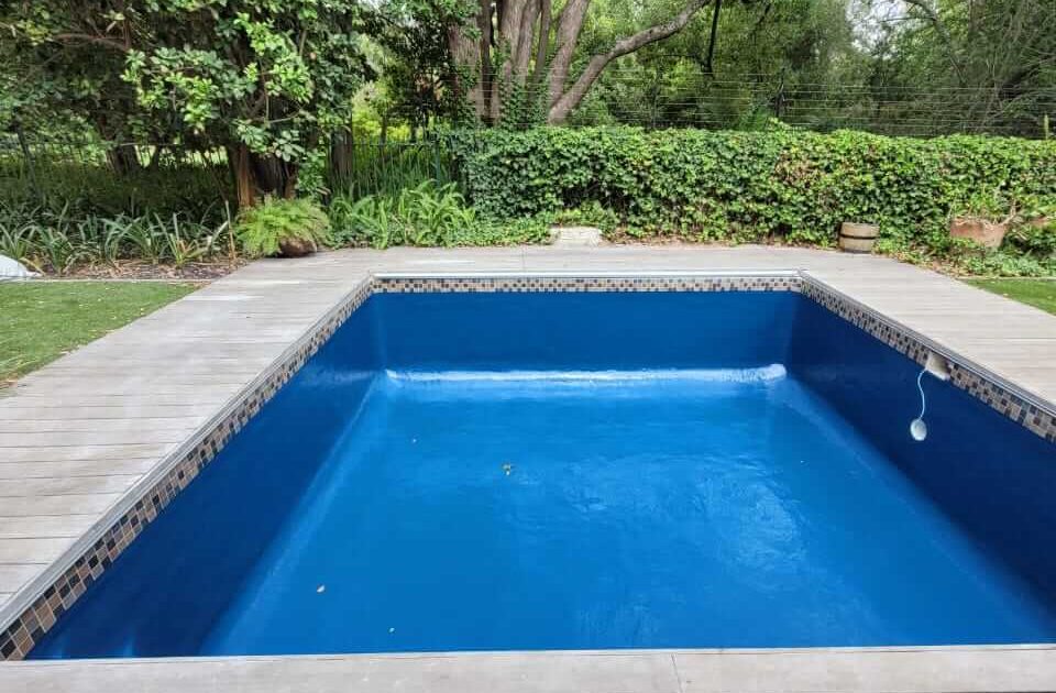 Finished fibreglass swimming pool in Tableview Cape Town with smooth gelcoat finish after relining and renovation