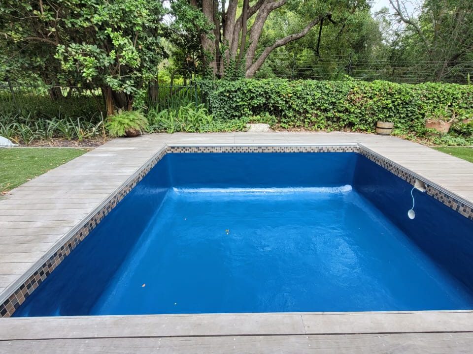 “Fibreglass pool in dark colours: charcoal, dark grey, midnight blue”
