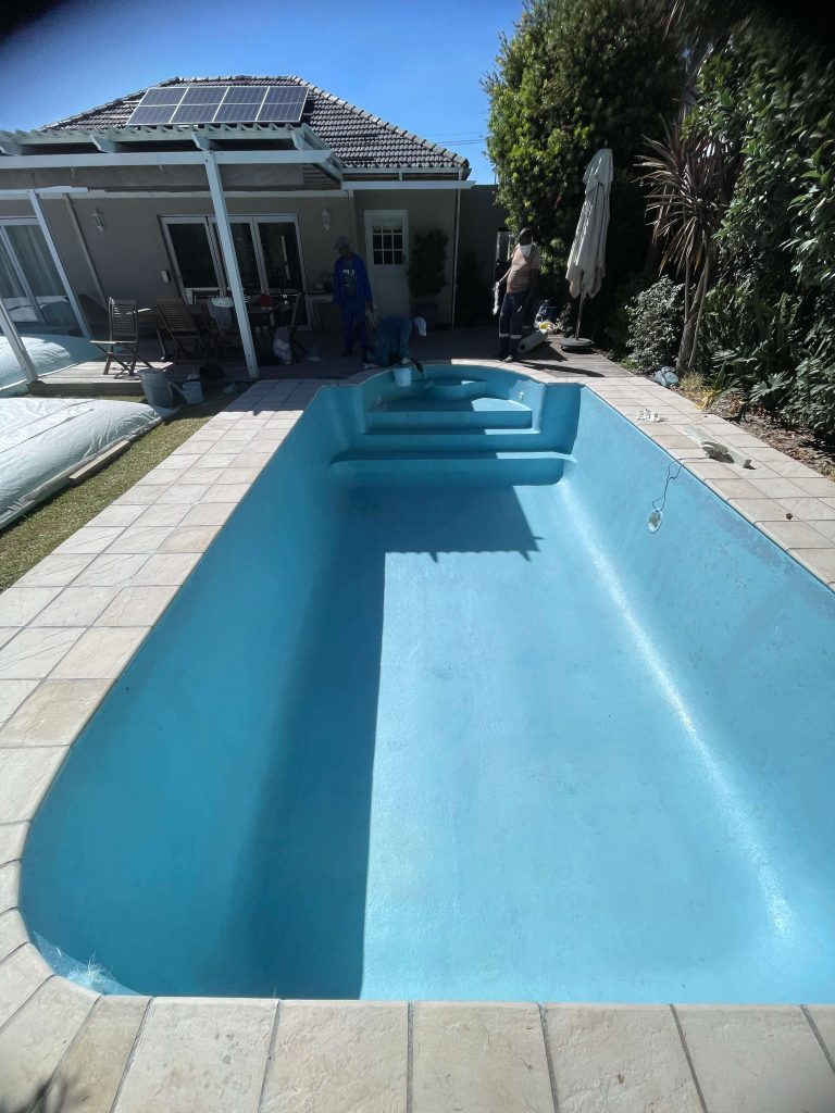 Newly fibreglass relined swimming pool in Kuils River Cape Town with smooth modern finish after pool renovation and resurfacing