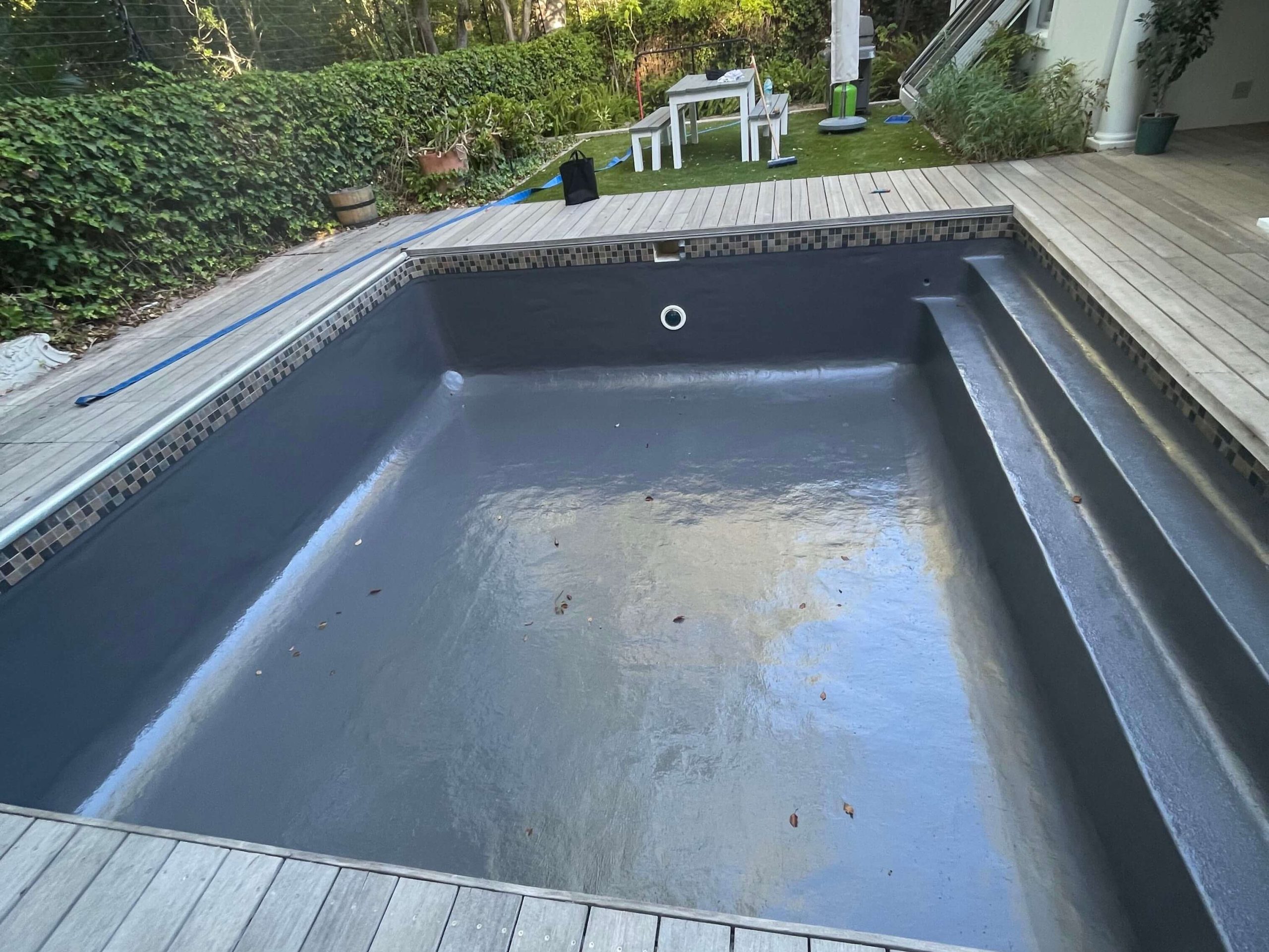 Newly fibreglass lined and painted grey swimming pool in Cape Town with a smooth durable finish after professional pool resurfacing