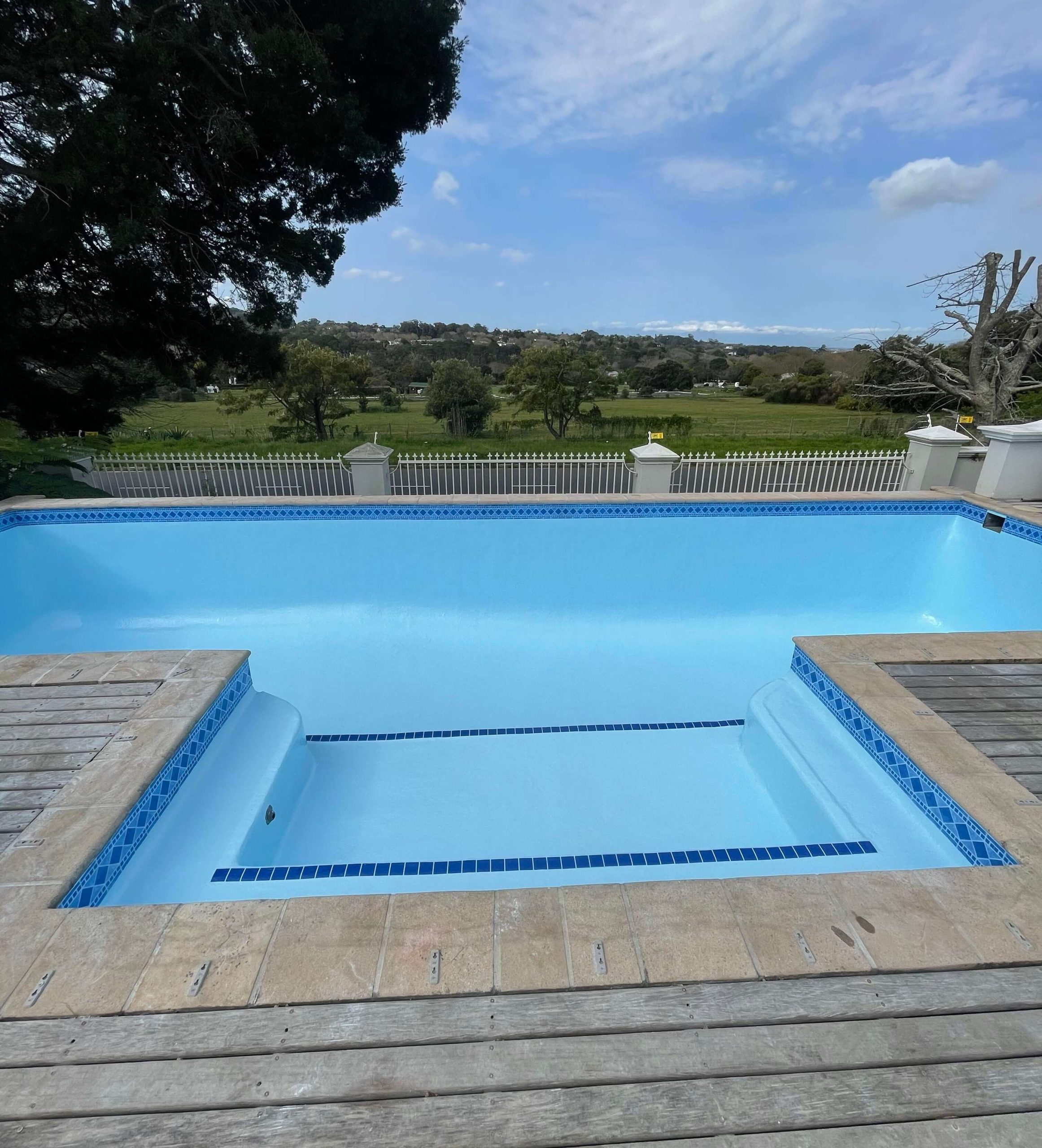 Modern renovated swimming pool with clear water and fibreglass finish in Cape Town South Africa