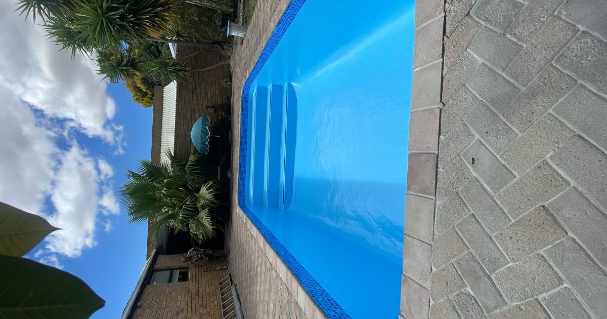 Newly fibreglass lined swimming pool with modern blue finish in Kleinmond Western Cape