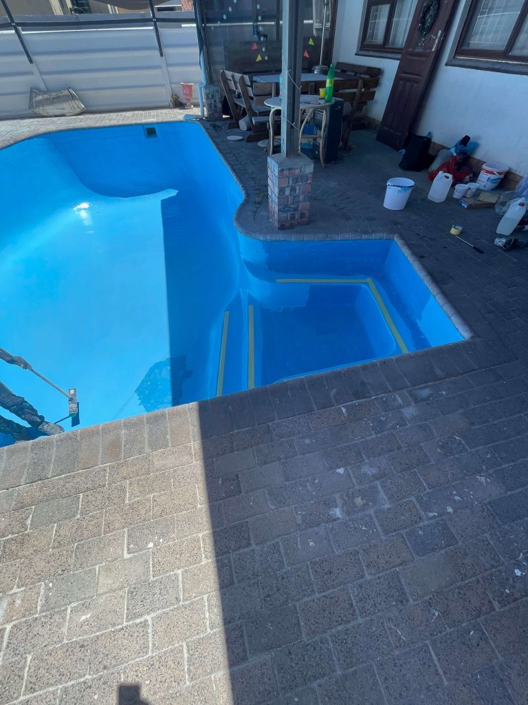 Applying gelcoat finish to a fibreglass swimming pool in Parow Cape Town creating a smooth durable waterproof surface