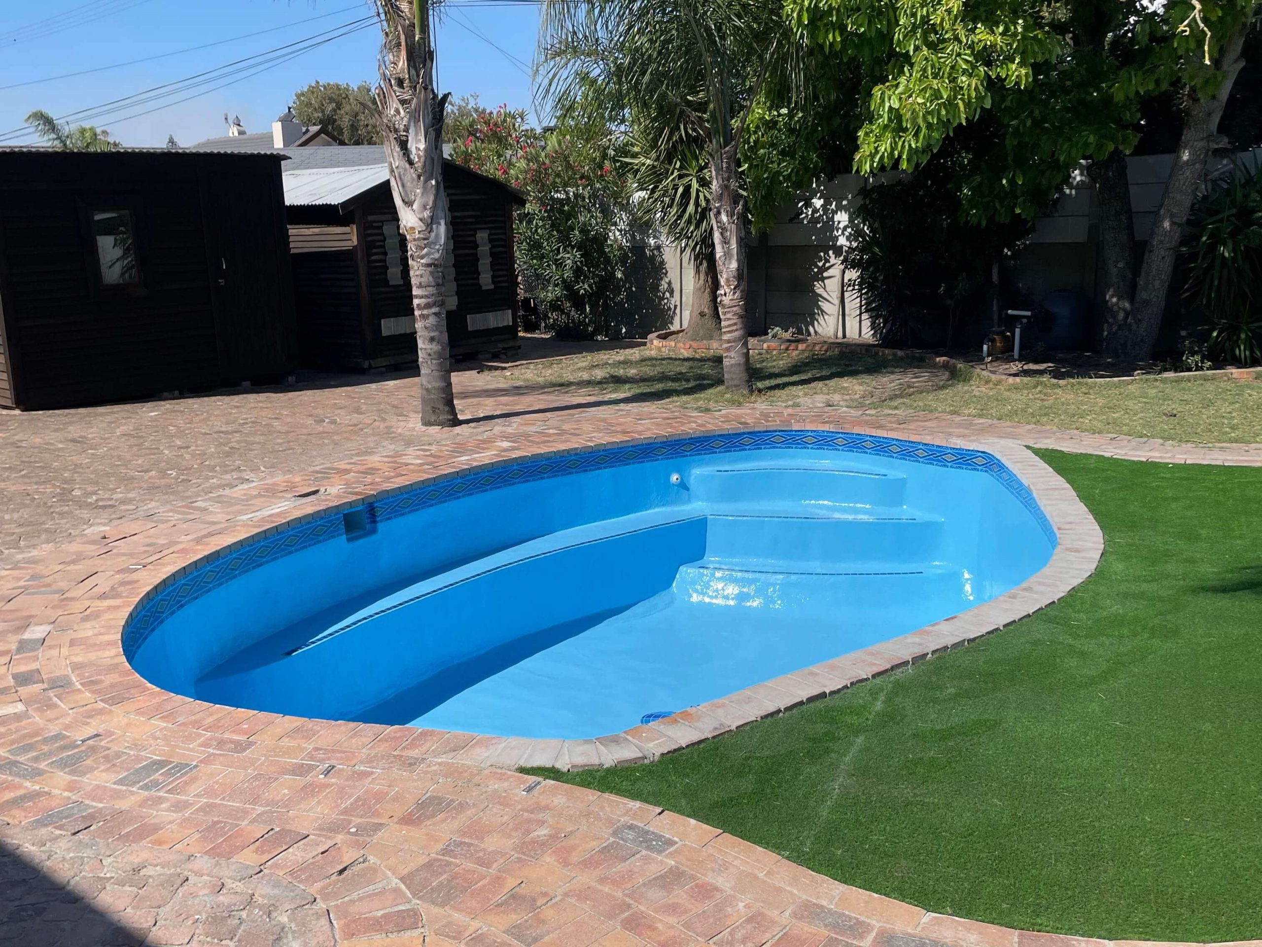 Newly fibreglass lined and painted pool with blue finish in Cape Town showing smooth durable surface after professional pool resurfacing