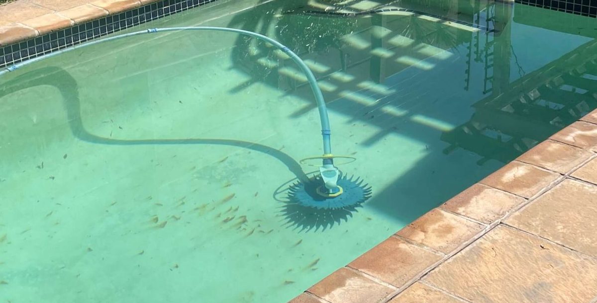 Rust stained marbelite swimming pool surface showing brown discoloration and metal staining in Cape Town