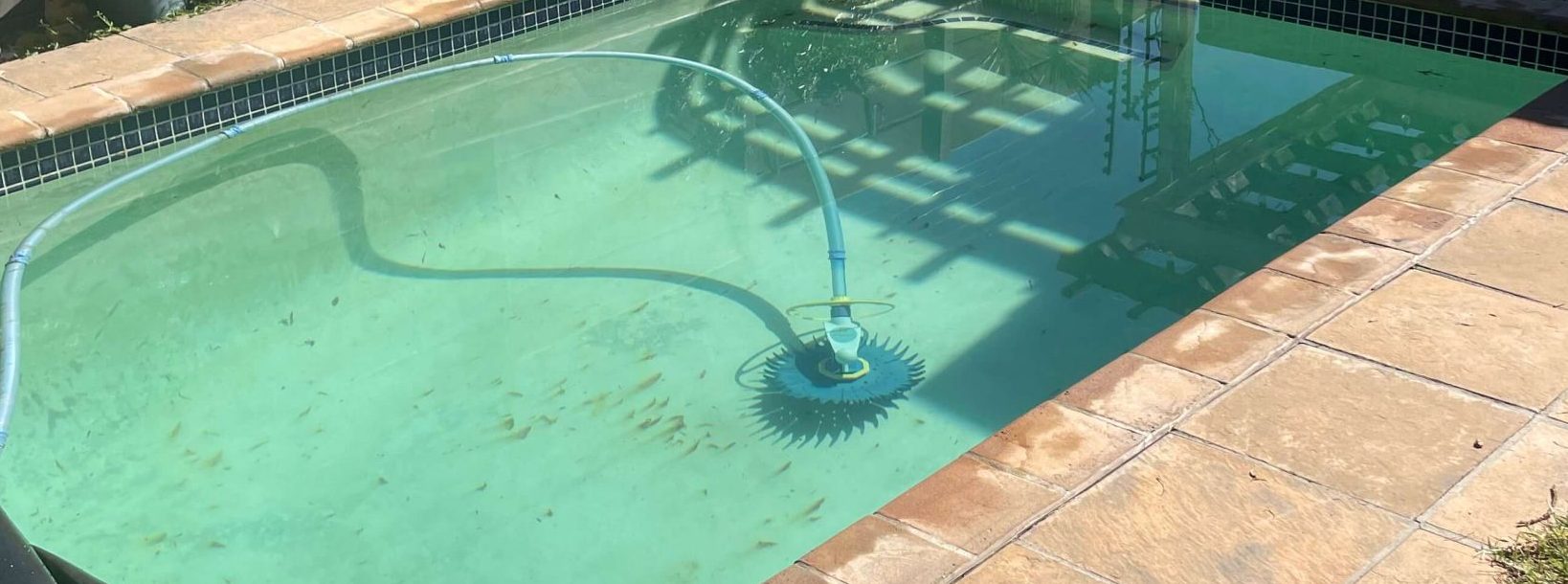 Rust stained marbelite swimming pool surface showing brown discoloration and metal staining in Cape Town