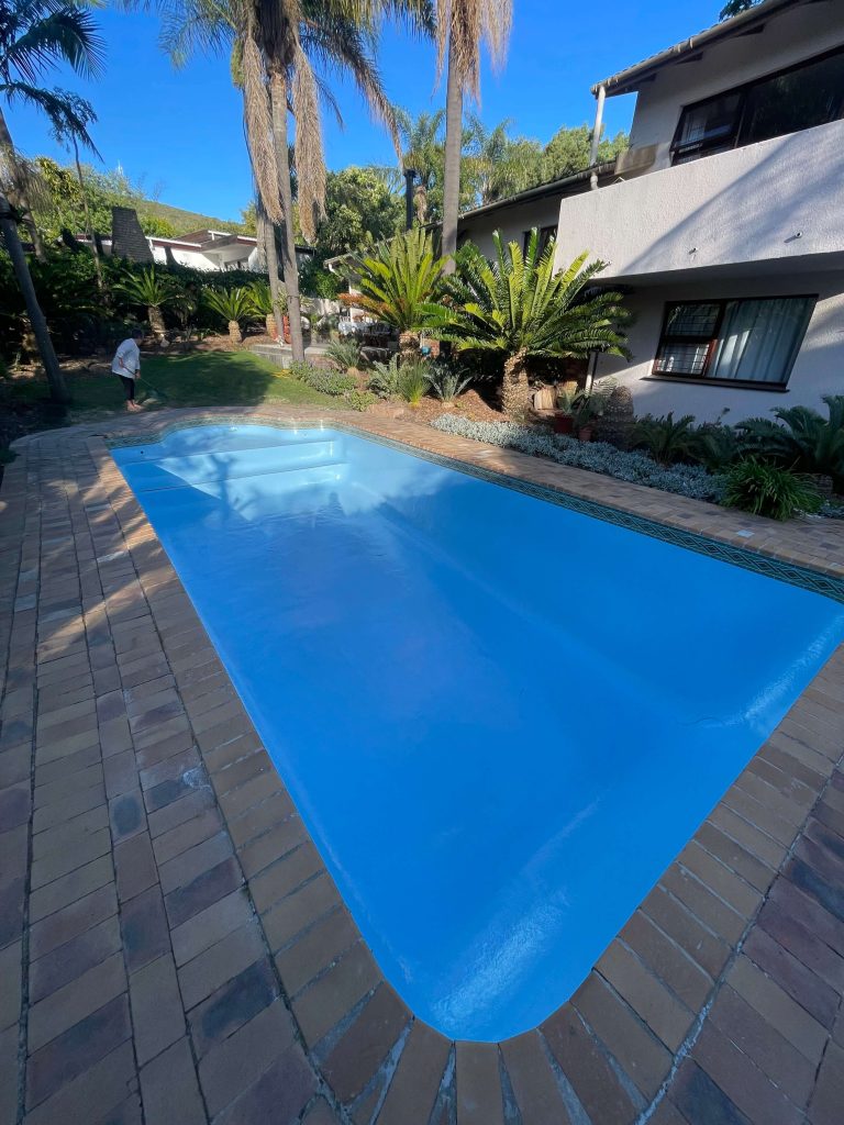 Finished fibreglass relined swimming pool in Goodwood Cape Town with smooth modern finish after pool resurfacing and renovation