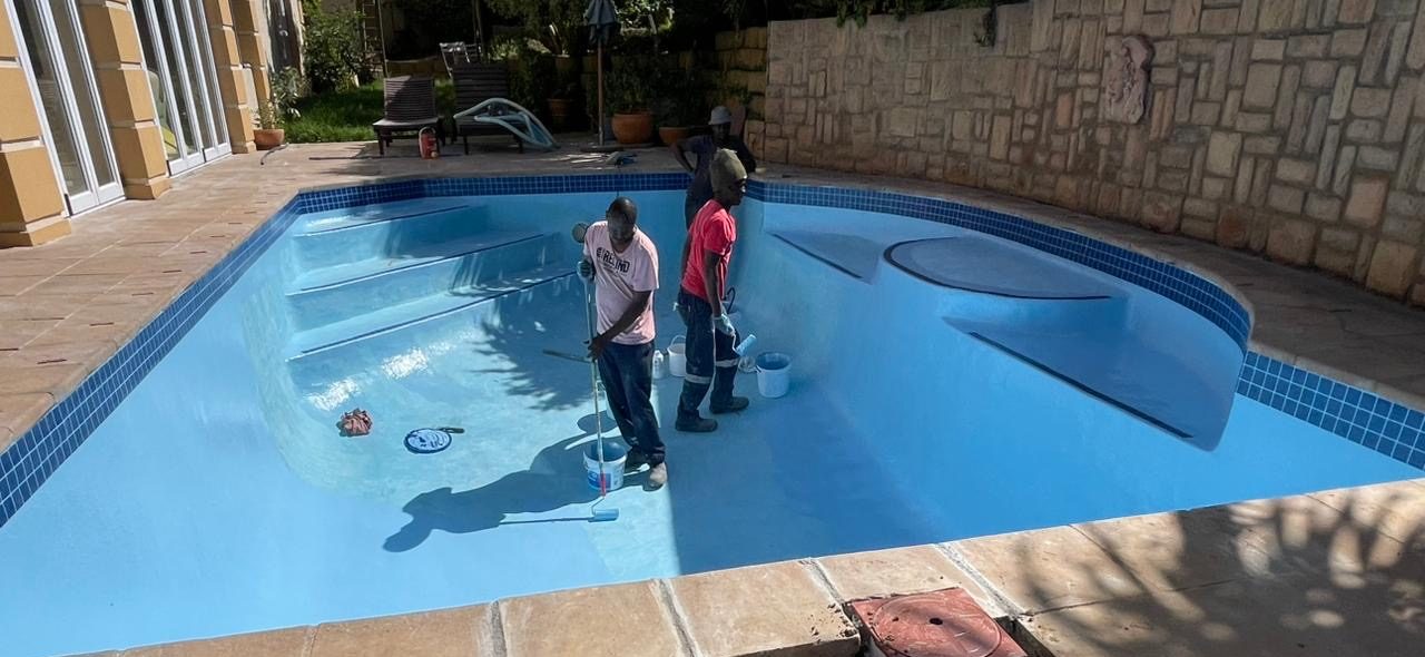 Applying gelcoat finish to a fibreglass swimming pool in Langebaan creating a smooth durable waterproof surface for coastal conditions