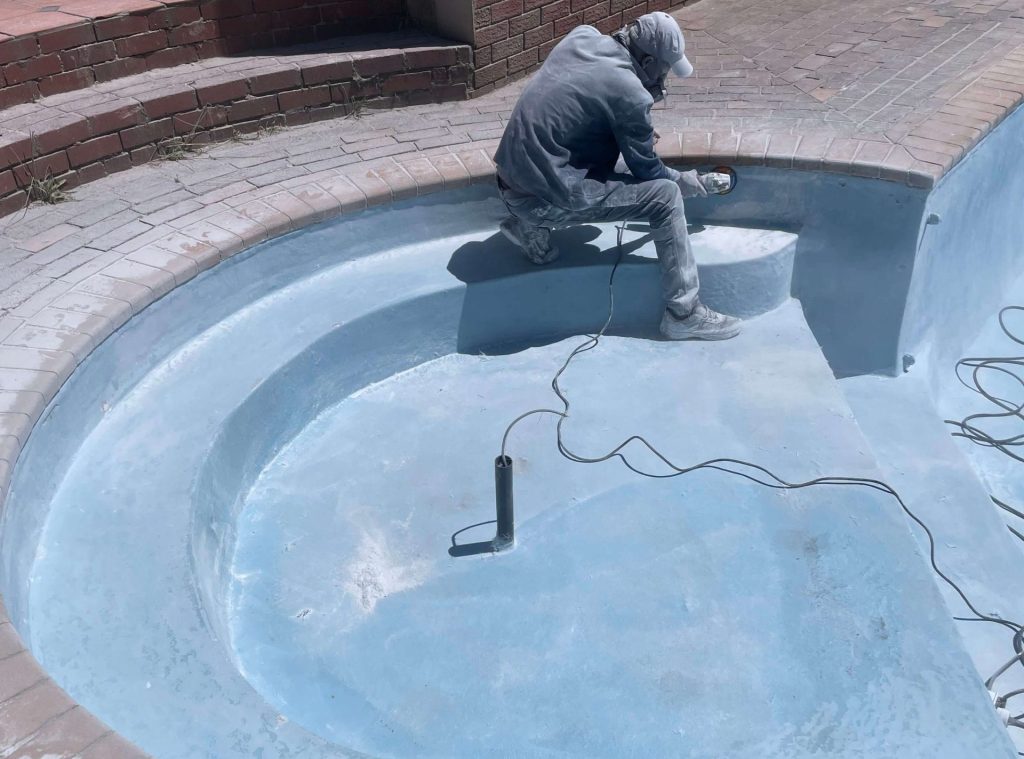 Swimming pool surface preparation before fibreglass lining