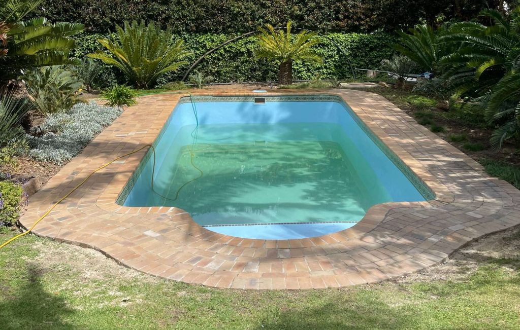 Newly renovated fibreglass swimming pool in Durbanville with smooth blue finish, clean modern appearance and upgraded pool interior surface
