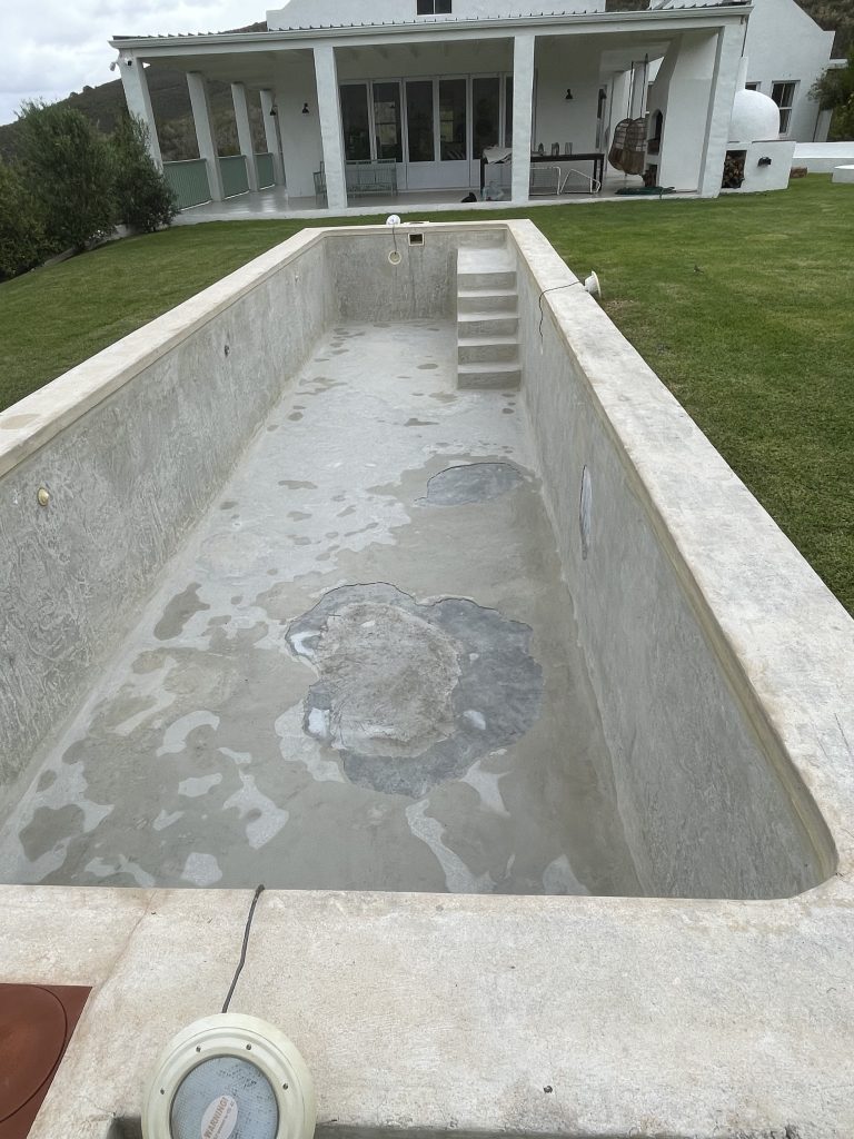 Before and after swimming pool renovation in Langebaan showing cracked old surface transformed into modern blue pool