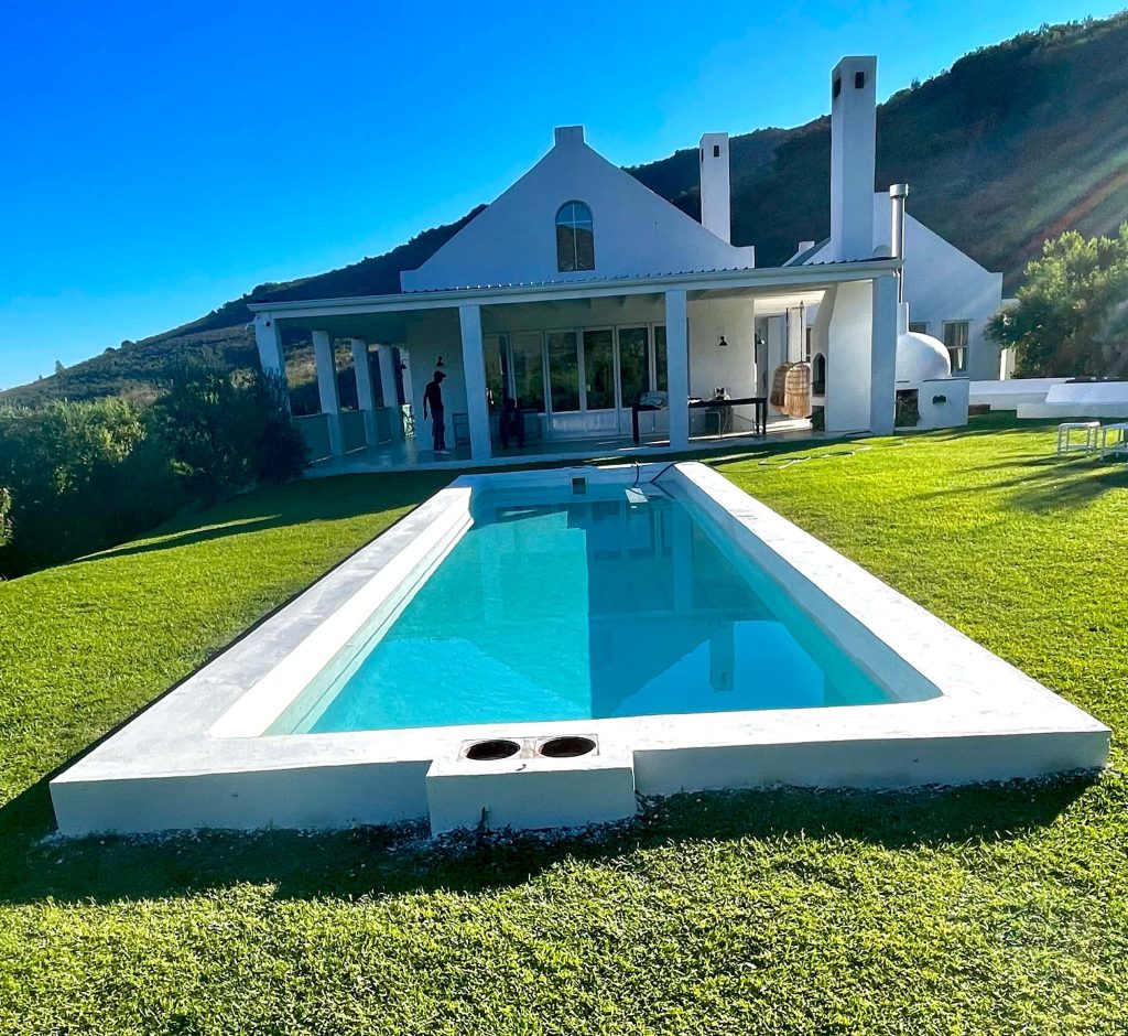 Newly resurfaced marbelite swimming pool in Malmesbury with smooth bright finish, crystal clear water and modern renovated outdoor entertainment area by Pools Reno Western Cape