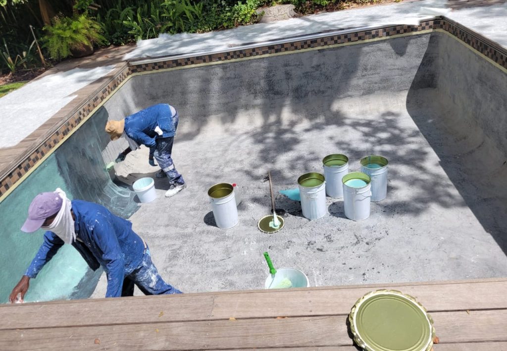 Fibreglass pool relining process in Malmesbury showing surface preparation, fibreglass application and swimming pool restoration work by Pools Reno Western Cape